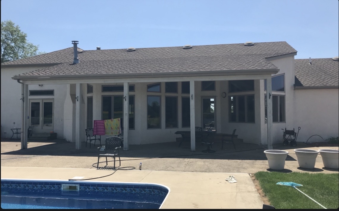 Shelter King Roofing completed roof beside swimming pool